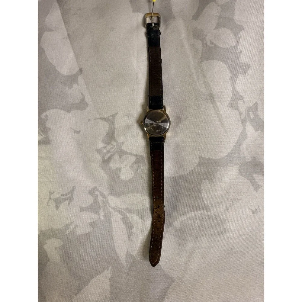 Citron Vintage Women’s Watch, White dial and gold casing. Black leather band.